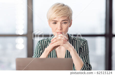 Thoughtful Business Lady Thinking Working On Laptop At Workplace Thoughtful Business Lady Thinking Working On Laptop At Workplace 62515124
