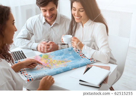 Plan journey. Happy couple choosing place for vacation 62515255