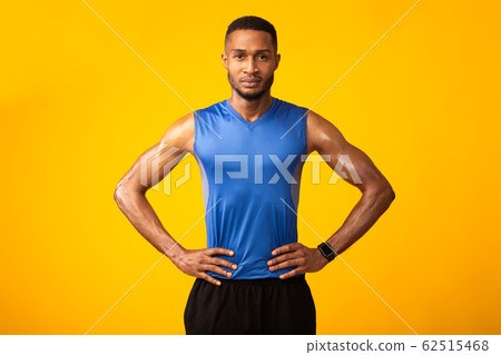 Front view portrait of serious afro sportsman 62515468