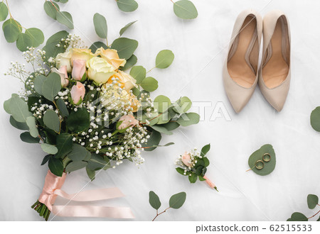 Wedding accessories in bride and groom room on white 62515533