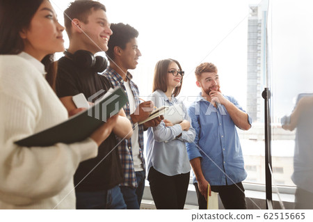 College friends solving and discussing math equations together College friends solving and discussing math equations together 62515665