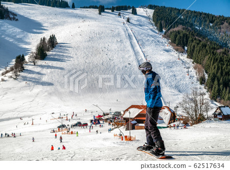 RUZOMBEROK, SLOVAKIA - FEBRUARY 15: Snowboarder on slope in resort Malino Brdo on February 15, 2020 in Ruzomberok 62517634