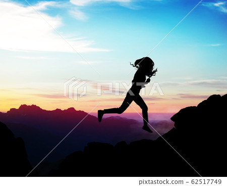 Black silhouette of woman running forward on the rock. Black silhouette of woman running forward on the rock. 62517749
