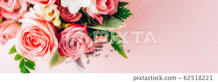 Beautiful and tender bouquet of flowers in the hat Beautiful and tender bouquet of flowers in the hat 62518221