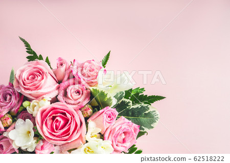 Beautiful and tender bouquet of flowers in the hat Beautiful and tender bouquet of flowers in the hat 62518222