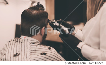 Portrait of man in barbershop. Portrait of man in barbershop. 62518224