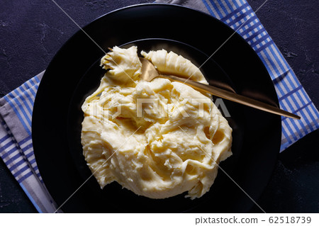 close-up of aligot, cheesy mashed potato dish close-up of aligot, cheesy mashed potato dish 62518739
