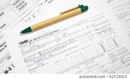Filled document 1040 Tax Form with pen Filled document 1040 Tax Form with pen 62518823