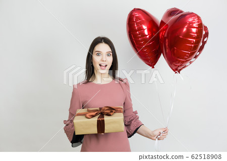 Happy girl with birthday presents. 62518908