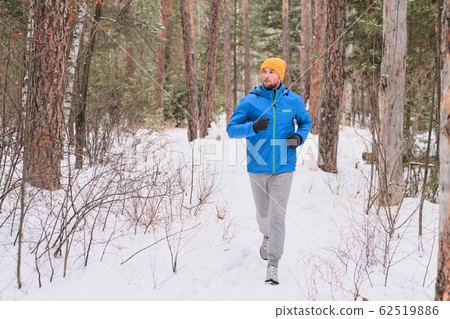 Man running on snow 62519886