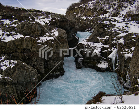 The snowy gorge of Barnafoss Waterfall The snowy gorge of Barnafoss Waterfall 62520651