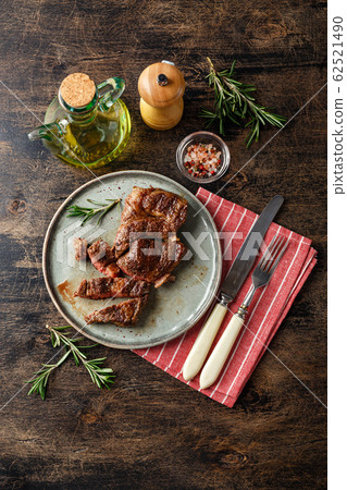 Two beef steak on dark gray background Two beef steak on dark gray background 62521490