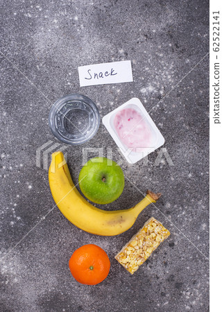 Apple, yogurt, banana and granola bar Apple, yogurt, banana and granola bar 62522141