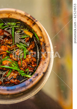 Delicious Singapore braised frog and spring onion in clay pot Delicious Singapore braised frog and spring onion in clay pot 62524653