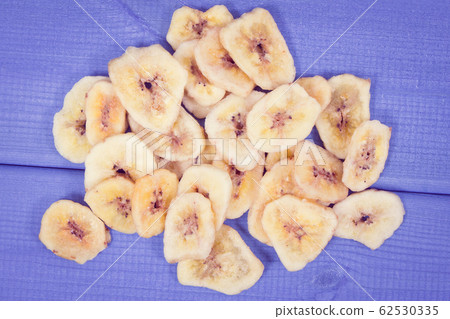 Homemade dried chips of banana for snack Homemade dried chips of banana for snack 62530335