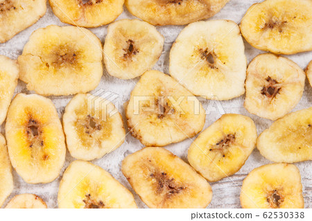 Homemade dried chips of banana for snack Homemade dried chips of banana for snack 62530338