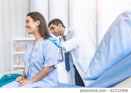 Asian doctor check-up pretty patient from her back for her backache healthy 62532906