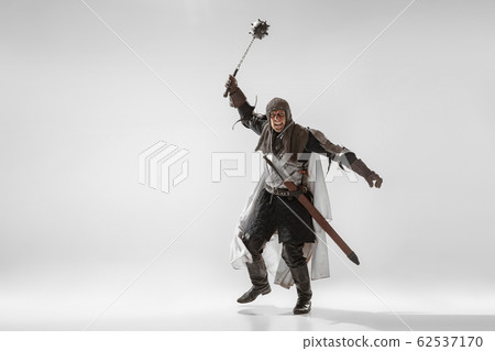 Brave armored knight fighting isolated on white studio background 62537170