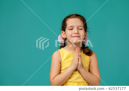 happy beautiful little girl asking for something. 62537177