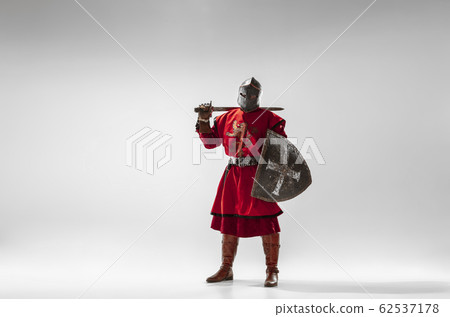 Brave armored knight fighting isolated on white studio background 62537178