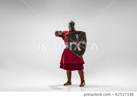 Brave armored knight fighting isolated on white studio background Brave armored knight fighting isolated on white studio background 62537186