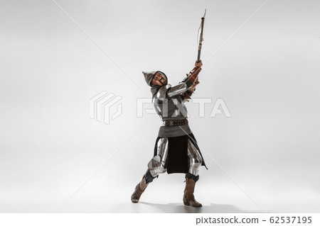 Brave armored knight fighting isolated on white studio background Brave armored knight fighting isolated on white studio background 62537195