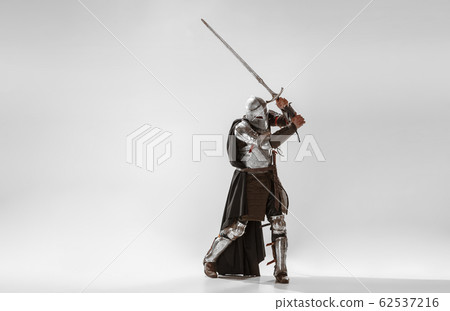 Brave armored knight fighting isolated on white studio background Brave armored knight fighting isolated on white studio background 62537216