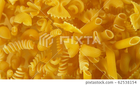 Freeze motion of flying uncooked pasta Freeze motion of flying uncooked pasta 62538154