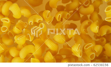 Freeze motion of flying uncooked pasta Freeze motion of flying uncooked pasta 62538156