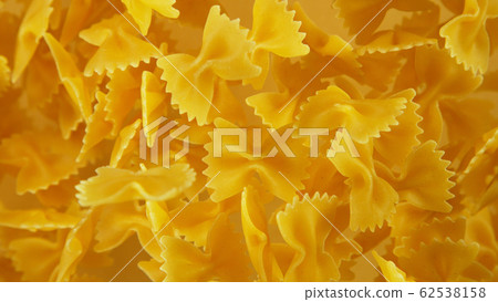 Freeze motion of flying uncooked pasta Freeze motion of flying uncooked pasta 62538158
