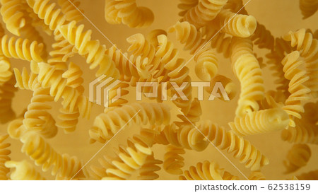 Freeze motion of flying uncooked pasta Freeze motion of flying uncooked pasta 62538159