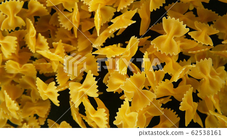 Freeze motion of flying uncooked pasta Freeze motion of flying uncooked pasta 62538161