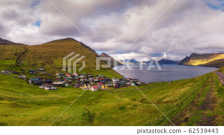 Panorama of mountains and ocean around village of Funningur on Faroe Islands 62539443