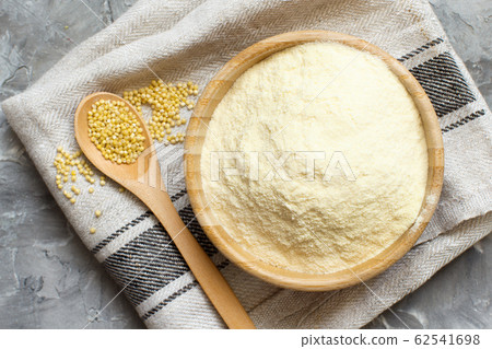 Hulled millet flour and grain top view Hulled millet flour and grain top view 62541698