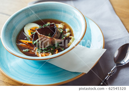 Lunch Time. Noodle soup isolated on table close-up Lunch Time. Noodle soup isolated on table close-up 62545320
