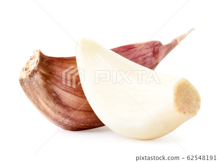 Garlic clove and peeled close-up on a white Garlic clove and peeled close-up on a white 62548191