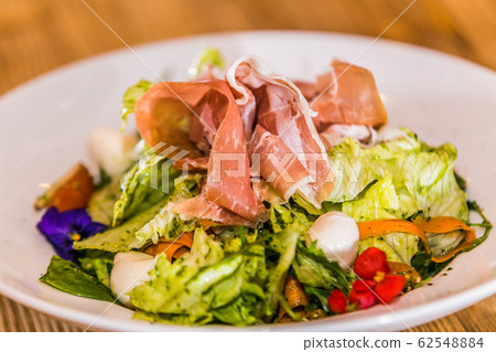 Fresh and healthy vegetable salad with ham Fresh and healthy vegetable salad with ham 62548884