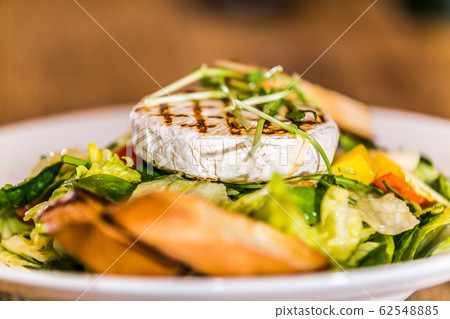 Fresh and healthy vegetable salad with cheese Fresh and healthy vegetable salad with cheese 62548885