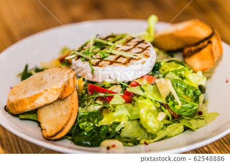 Fresh and healthy vegetable salad with cheese Fresh and healthy vegetable salad with cheese 62548886