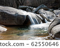 Small waterfall in rock valley 62550646