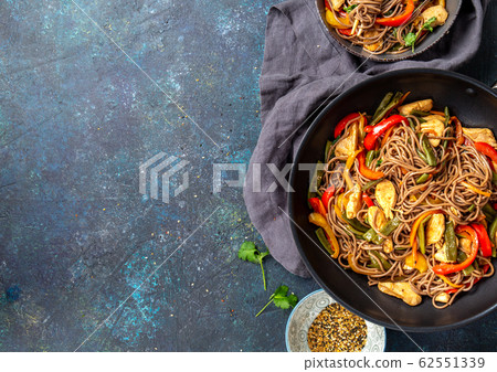 Japanese dish buckwheat soba noodles with chicken and vegetables carrot, bell pepper and green beans 62551339