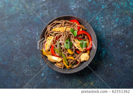 Japanese dish buckwheat soba noodles with chicken and vegetables carrot, bell pepper and green beans 62551362