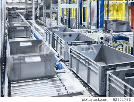 Conveyor system with boxes in motion. Conveyor system with boxes in motion. 62551728