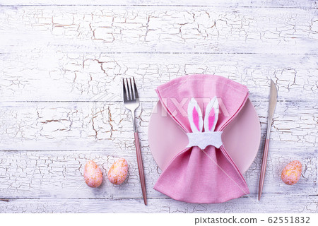 Easter table setting in pink color Easter table setting in pink color 62551832