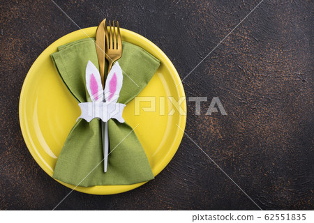 Easter table setting in green color Easter table setting in green color 62551835