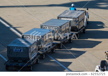 Towing tractors and containers @ Itami Airport Towing tractors and containers @ Itami Airport 62552725