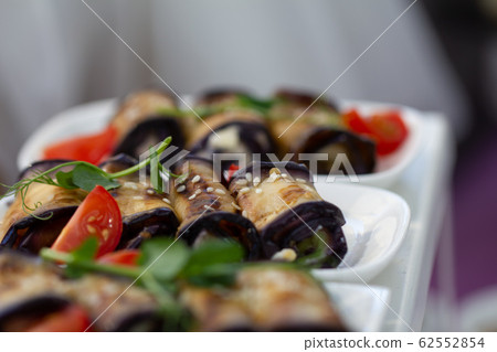 Eggplant rolls with nuts. Caucasian cuisine. Vegetarian food. 62552854