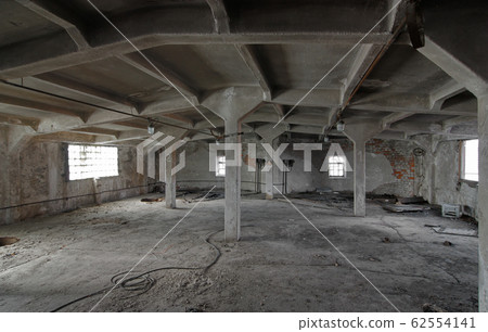 The interior of an empty industrial room of an old The interior of an empty industrial room of an old 62554141