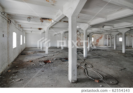 Empty industrial room of an old abandoned factory 62554143