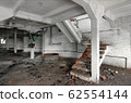 An old staircase inside an abandoned industrial 62554144